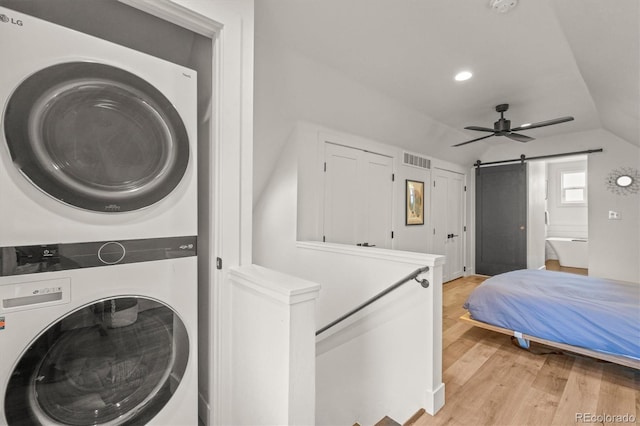3317 W 37th Ave, Denver, CO 80211 - laundry area with visible vents, light wood-style floors, a ceiling fan, stacked washer / drying machine, and laundry area