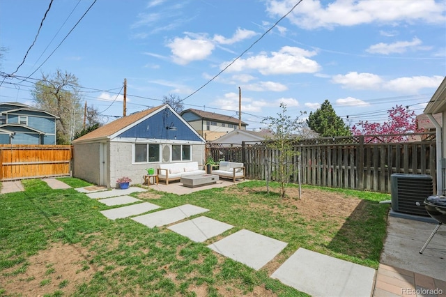 3317 W 37th Ave, Denver, CO 80211 - back of property featuring a fenced backyard, central AC unit, a lawn, an outdoor hangout area, and a patio