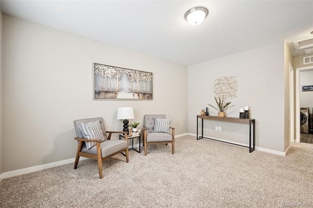 sitting room featuring carpet flooring and baseboards