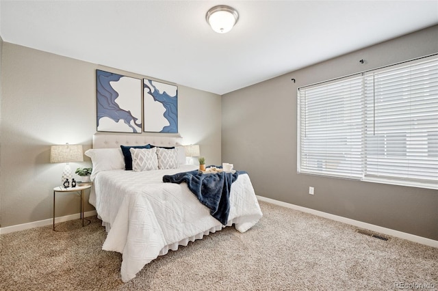 bedroom with carpet, baseboards, and visible vents