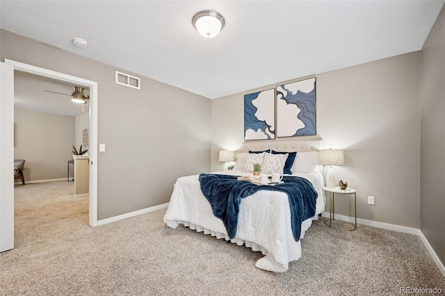 bedroom with carpet, visible vents, and baseboards