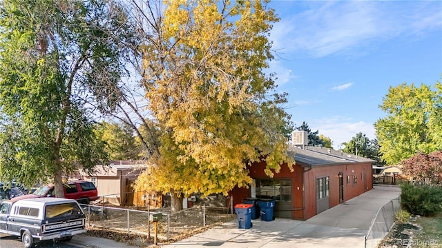 view of property hidden behind natural elements