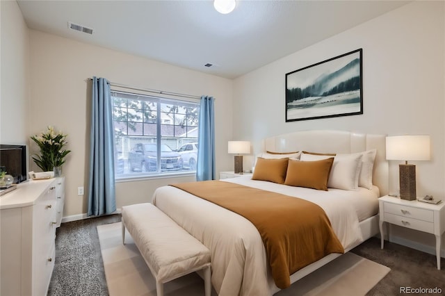 bedroom featuring dark carpet