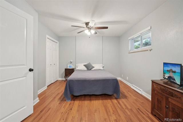 4895 S Galapago St, Englewood, CO 80110 - bedroom featuring light wood-style floors, ceiling fan, and baseboard heating