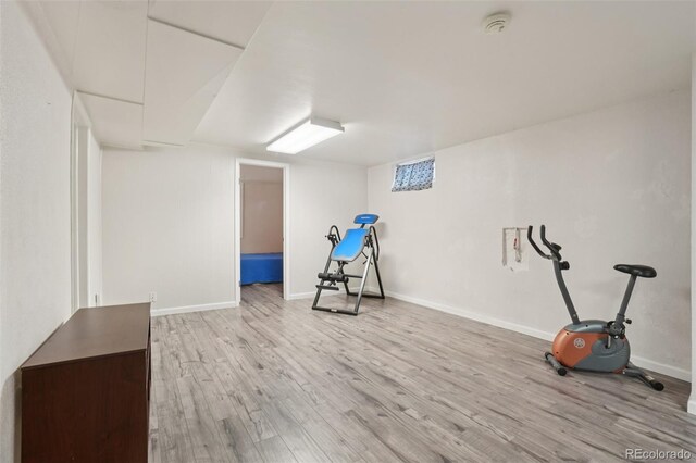 4895 S Galapago St, Englewood, CO 80110 - workout room featuring wood finished floors and baseboards