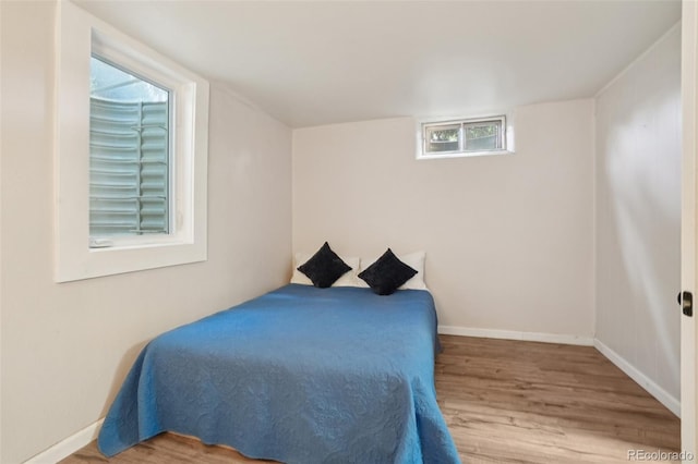 4895 S Galapago St, Englewood, CO 80110 - bedroom featuring wood finished floors and baseboards
