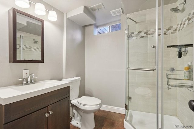 4895 S Galapago St, Englewood, CO 80110 - full bath with wood finished floors, vanity, and a shower stall