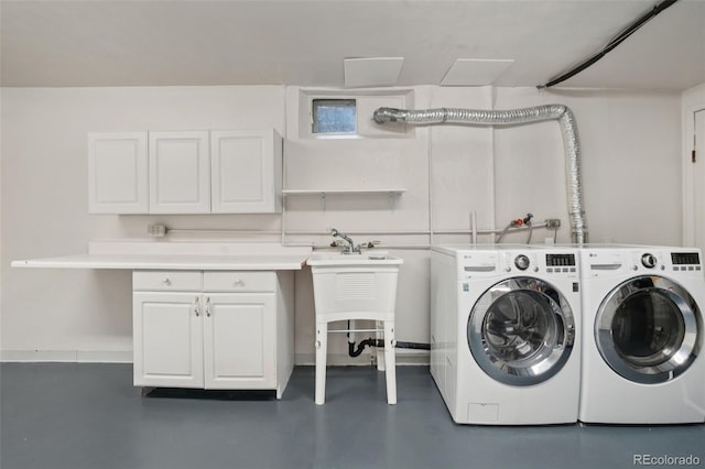 4895 S Galapago St, Englewood, CO 80110 - laundry area with cabinet space and washing machine and dryer