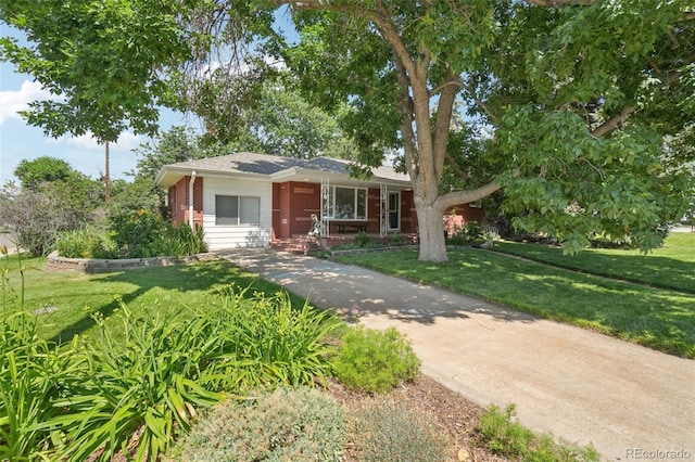 4895 S Galapago St, Englewood, CO 80110 - bungalow-style house featuring brick siding and a front yard