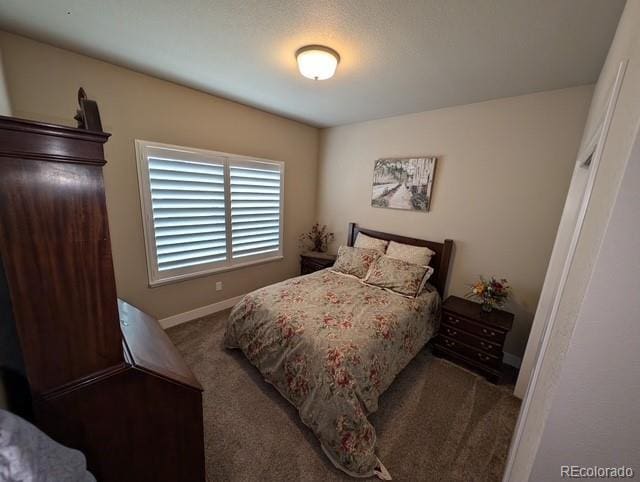 bedroom featuring carpet floors and baseboards