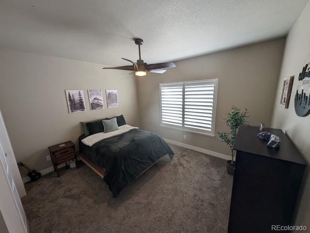 bedroom featuring a ceiling fan, carpet flooring, a textured ceiling, and baseboards