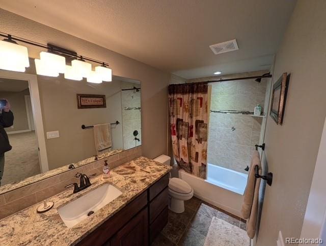 bathroom with shower / bath combination with curtain, visible vents, vanity, and toilet