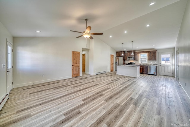 882 Hoover Cir, Poncha Springs, CO 81242 - unfurnished living room featuring baseboard heating, light wood-type flooring, ceiling fan, lofted ceiling, and baseboards