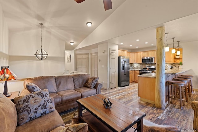85 Lookout Ridge Dr, Dillon, CO 80435 - living area with light wood finished floors, lofted ceiling, a ceiling fan, and recessed lighting