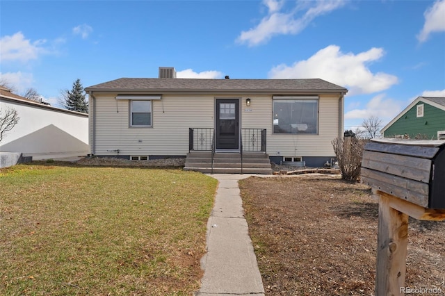 bungalow-style house with a front yard