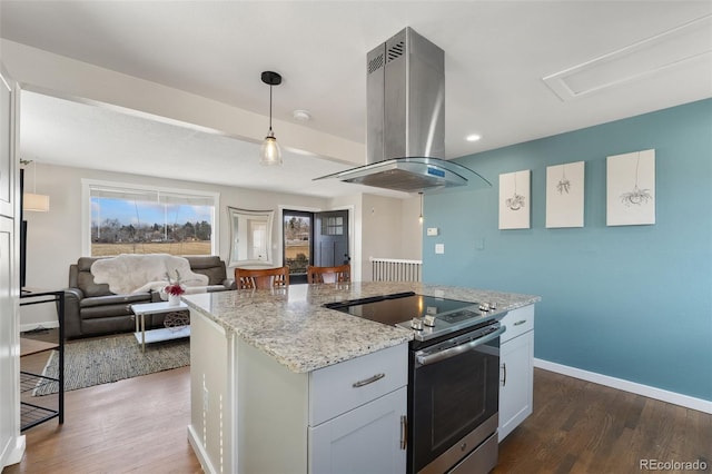 kitchen with baseboards, electric stove, dark wood-type flooring, and island range hood