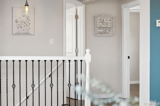 hallway featuring an upstairs landing