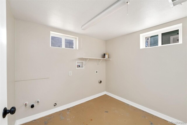 laundry area with laundry area, baseboards, hookup for a gas dryer, hookup for an electric dryer, and washer hookup