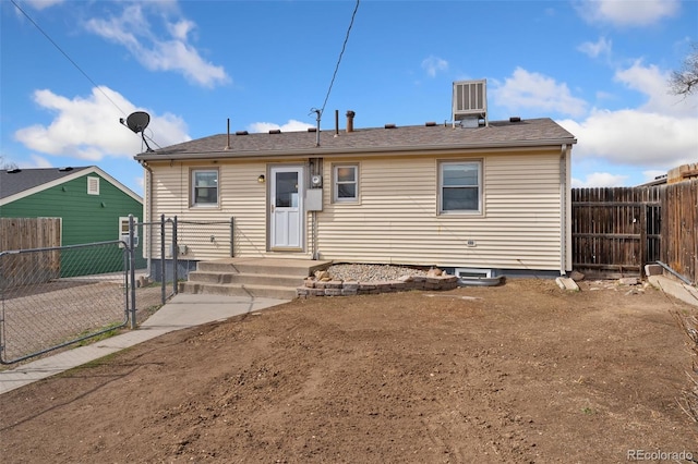 back of property with fence private yard and central air condition unit