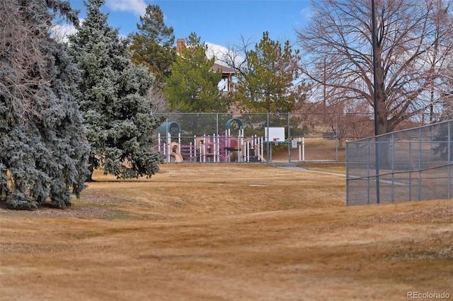 view of property's community with a yard and fence