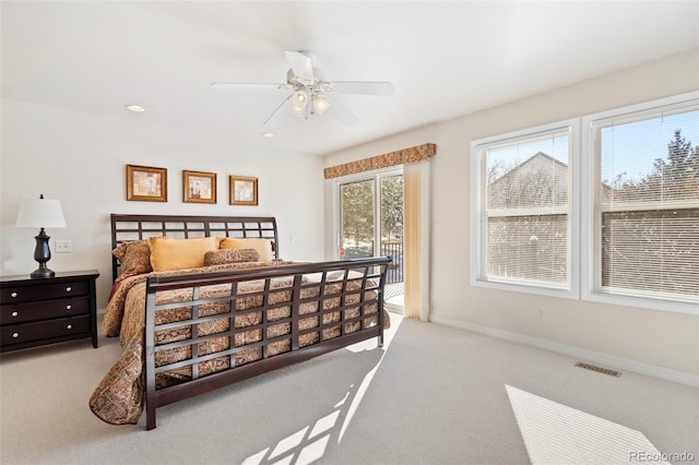 bedroom with ceiling fan, access to exterior, and light carpet