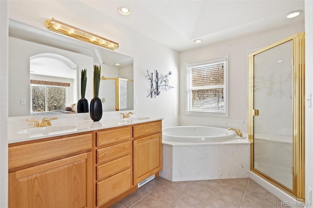 bathroom with shower with separate bathtub, tile patterned floors, and vanity