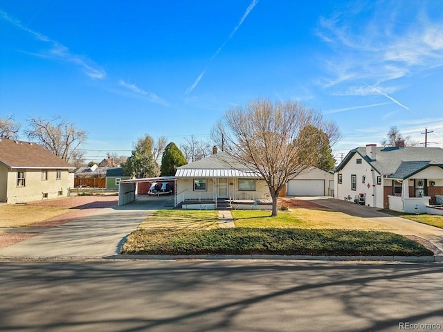 view of front facade featuring a carport and a front yard