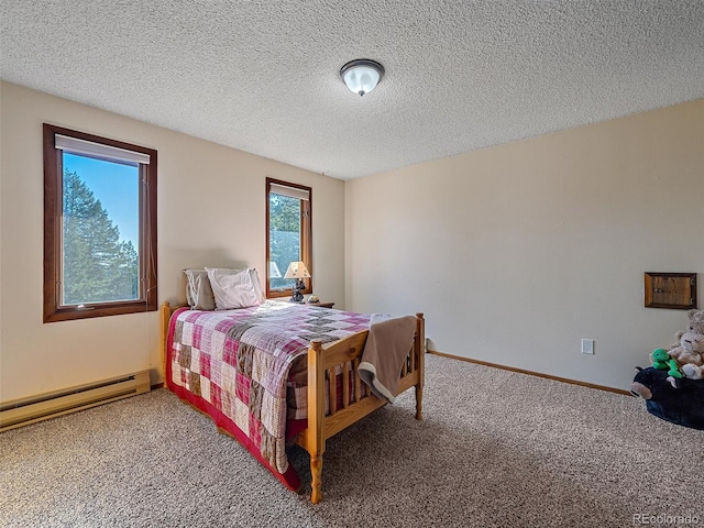 carpeted bedroom with a textured ceiling and baseboard heating