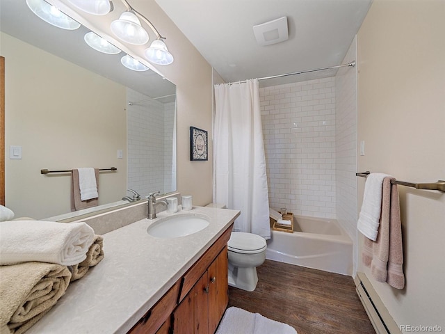 full bathroom with vanity, hardwood / wood-style floors, a baseboard heating unit, toilet, and shower / bath combo with shower curtain