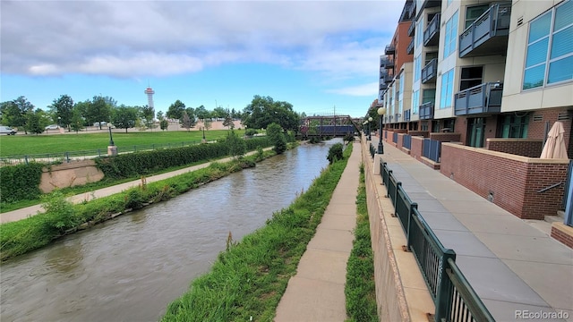 surrounding community featuring a water view