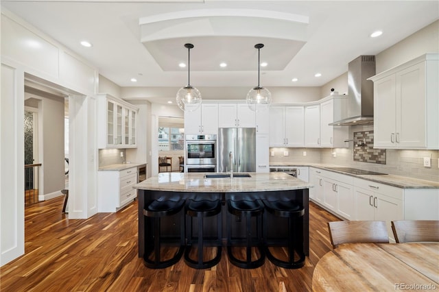 4193 W 99th Ct, Westminster, CO 80031 - kitchen featuring wall chimney range hood, stainless steel appliances, white cabinets, and recessed lighting