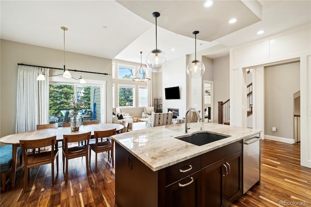 4193 W 99th Ct, Westminster, CO 80031 - kitchen with a sink, dark wood-type flooring, dark brown cabinets, pendant lighting, and recessed lighting