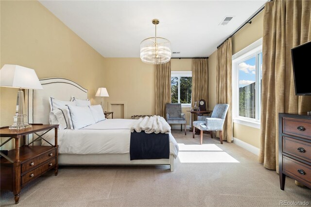 4193 W 99th Ct, Westminster, CO 80031 - bedroom with light carpet, a chandelier, and baseboards