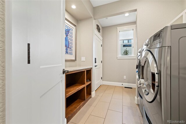 4193 W 99th Ct, Westminster, CO 80031 - laundry room with washer and clothes dryer, baseboards, light tile patterned flooring, and recessed lighting