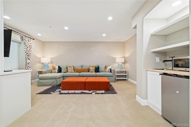 4193 W 99th Ct, Westminster, CO 80031 - living area featuring light colored carpet, recessed lighting, and baseboards
