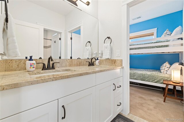 4193 W 99th Ct, Westminster, CO 80031 - full bath featuring double vanity and connected bathroom
