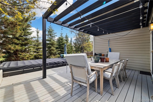 4193 W 99th Ct, Westminster, CO 80031 - wooden deck with outdoor dining space, a pergola, and view of wooded area