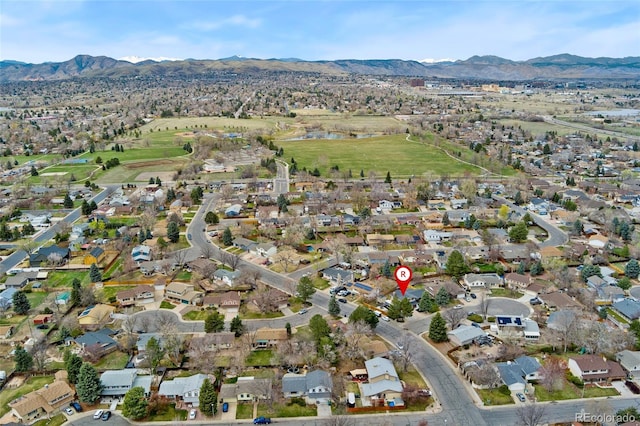 birds eye view of property with a residential view and a water and mountain view