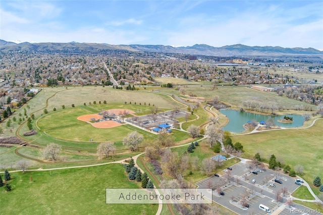 drone / aerial view with a water and mountain view