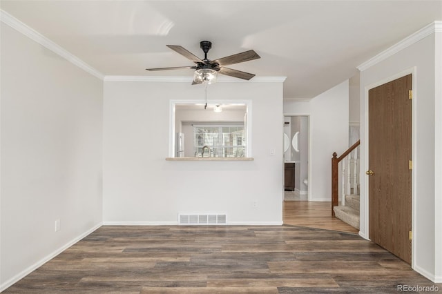 5316 S Jellison St, Littleton, CO 80123 - spare room featuring crown molding, ceiling fan, dark wood-style floors, and stairs