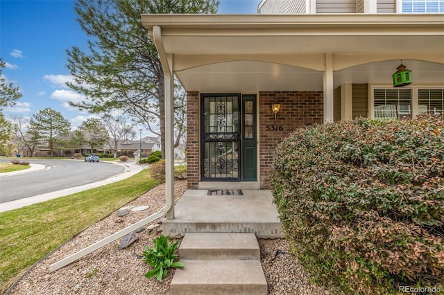 5316 S Jellison St, Littleton, CO 80123 - doorway to property featuring brick siding
