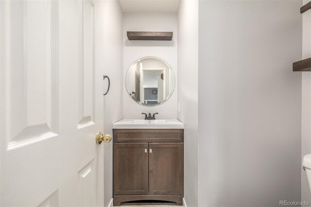 5316 S Jellison St, Littleton, CO 80123 - bathroom with vanity, toilet, and baseboards