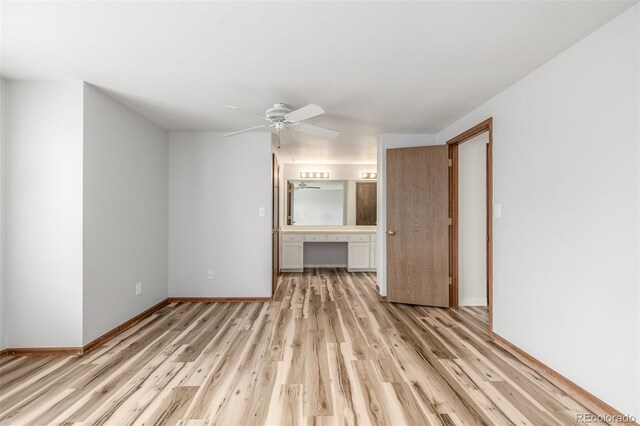 5316 S Jellison St, Littleton, CO 80123 - unfurnished bedroom featuring light wood finished floors, baseboards, ensuite bath, and a ceiling fan