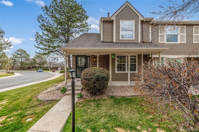 5316 S Jellison St, Littleton, CO 80123 - view of front facade featuring covered porch and a front yard