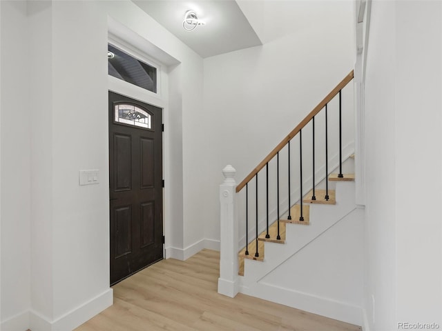 entryway with light hardwood / wood-style floors