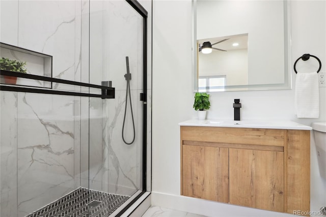 bathroom with ceiling fan, vanity, and an enclosed shower