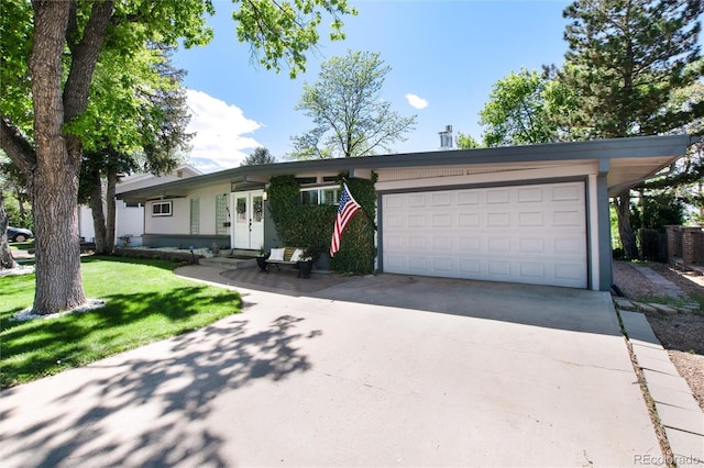 4545 S Lipan Ct, Englewood, CO 80110 - ranch-style house with driveway, a front yard, a garage, and entry steps