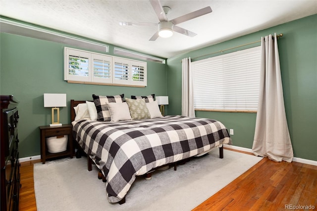 4545 S Lipan Ct, Englewood, CO 80110 - bedroom featuring wood finished floors, baseboards, and a ceiling fan