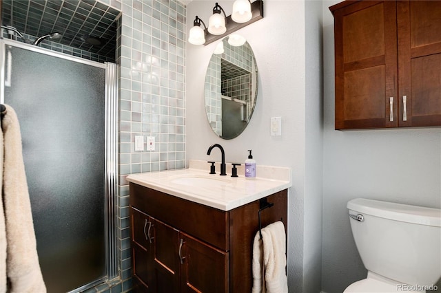 4545 S Lipan Ct, Englewood, CO 80110 - bathroom featuring vanity, a stall shower, and toilet
