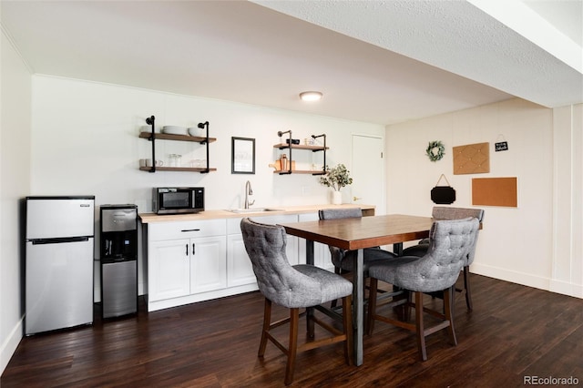 4545 S Lipan Ct, Englewood, CO 80110 - dining space with dark wood-type flooring and baseboards